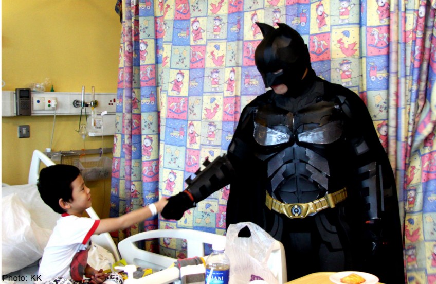 Die-hard Batman fans: Cop dresses up to cheer sick kids