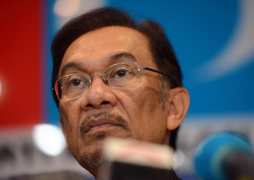 Malaysia king agrees to pardon Anwar after opposition election win