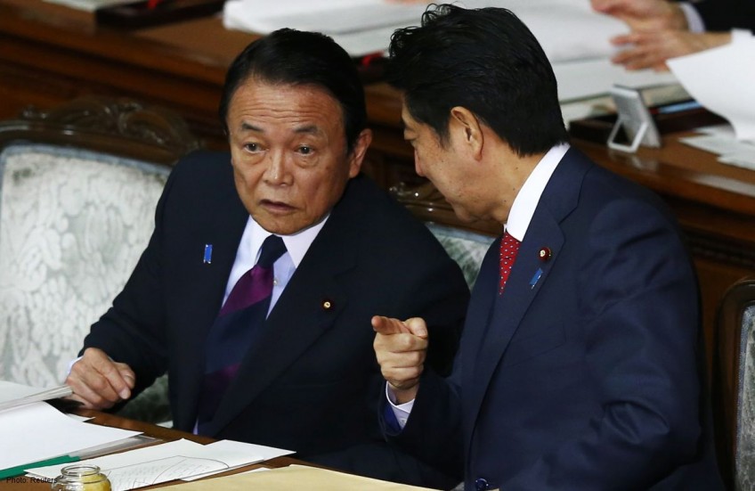 Japan's ruling camp wins local polls in 'Abenomics' litmus test: media 
