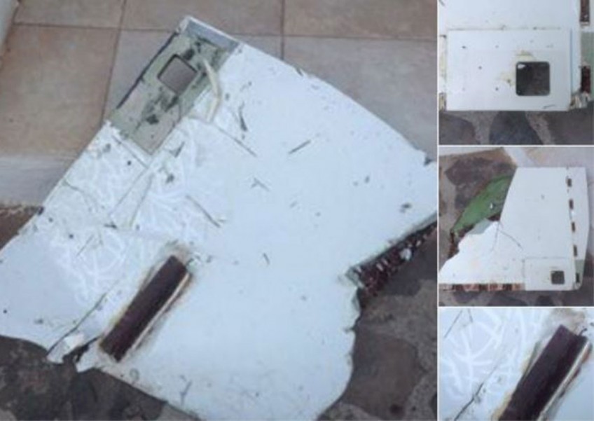 Experts examine new debris for MH370 clues