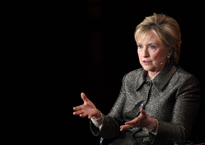 In campaign memoir, Clinton says won't 'sulk or disappear'