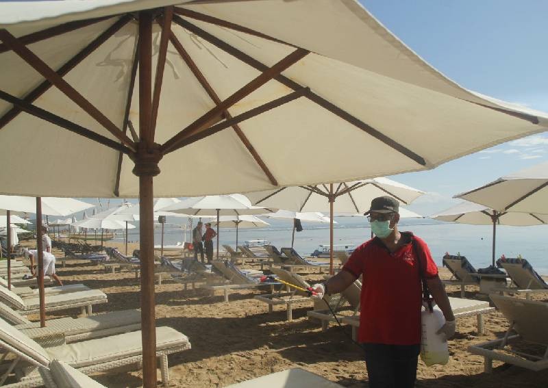 Sun, sea, sand and space as coronavirus empties Asia's beaches