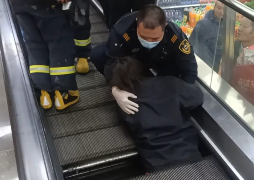 Mind the gap: Woman gets trapped in Shanghai travelator after stepping on missing floor plate