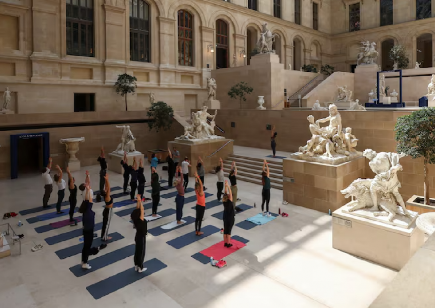 Parisians warm up for Olympics with workouts in Louvre museum