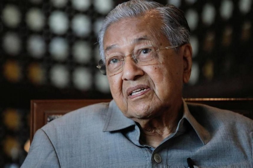Malaysia ex-PM Mahathir facing anti-graft probe in a case involving his sons
