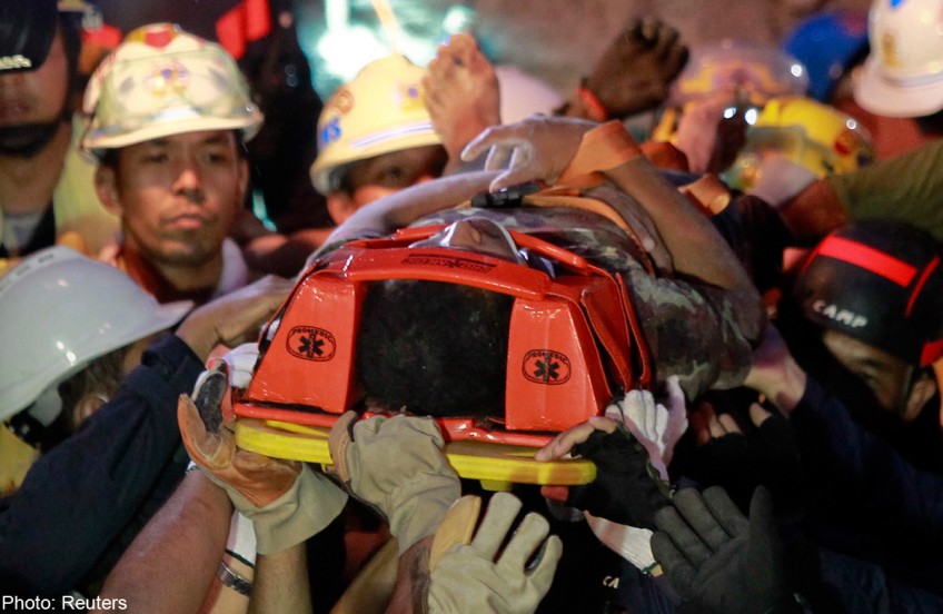 Rescuers pull survivor from collapsed Thai building