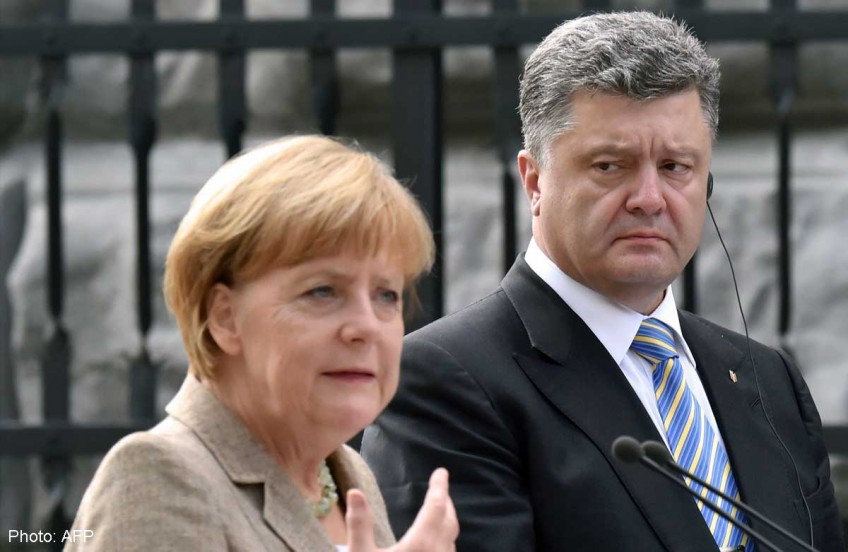 Merkel urges Ukraine truce as Russia convoy returns home