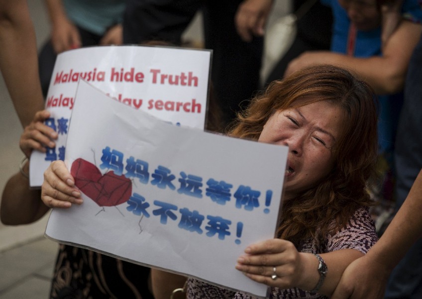 MH370 families reject Malaysia's conclusion on plane debris