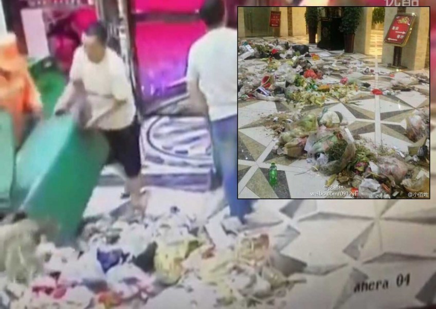 Caught on video: Sanitation workers dump rubbish in hotel lobby