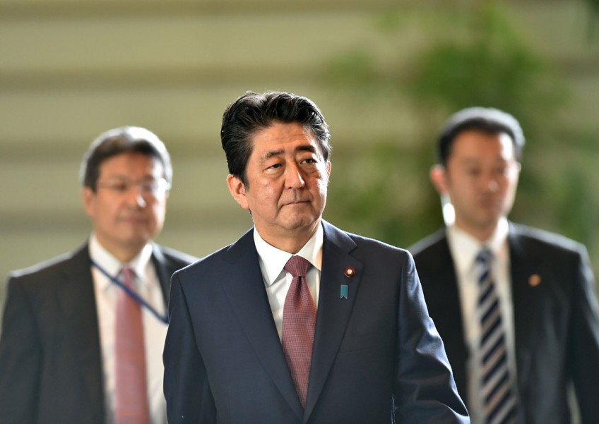 Beleaugered Japan PM seeks new start with cabinet revamp
