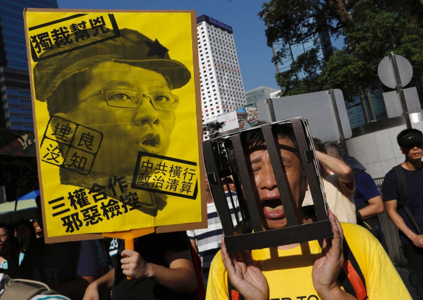 Tens of thousands protest in Hong Kong over jailing of democracy activists