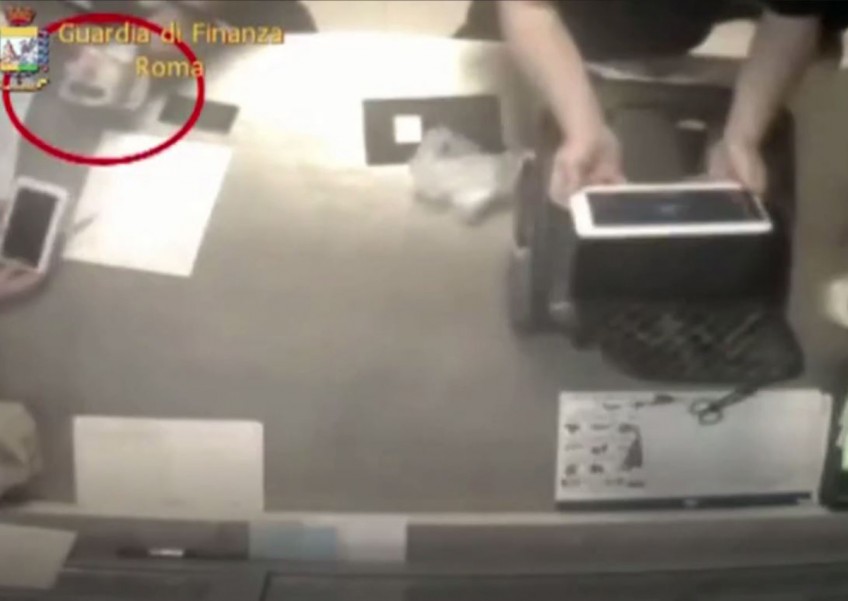 WATCH: Baggage handlers caught stealing items from luggage at Rome airport