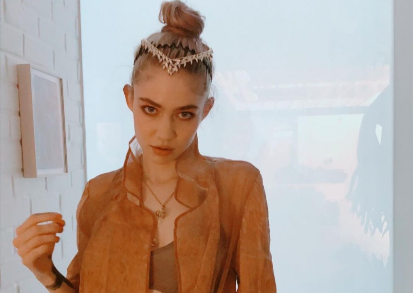Grimes thinks fight between Musk and Zuckerberg will happen but would 'prefer that it didn't'
