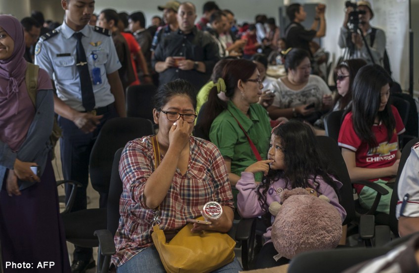 AirAsia flight QZ8501: Relatives of Indonesian passengers swarm Surabaya airport