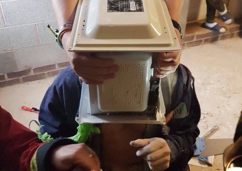 YouTuber gets head stuck in microwave oven in stunt gone wrong