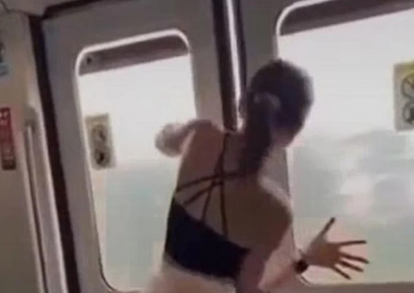Passenger filmed prying open MRT train doors: Man charged for being public nuisance