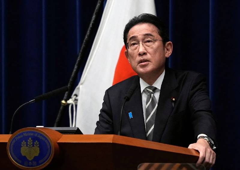 Japan PM overhauls cabinet in bid to weather financial scandal