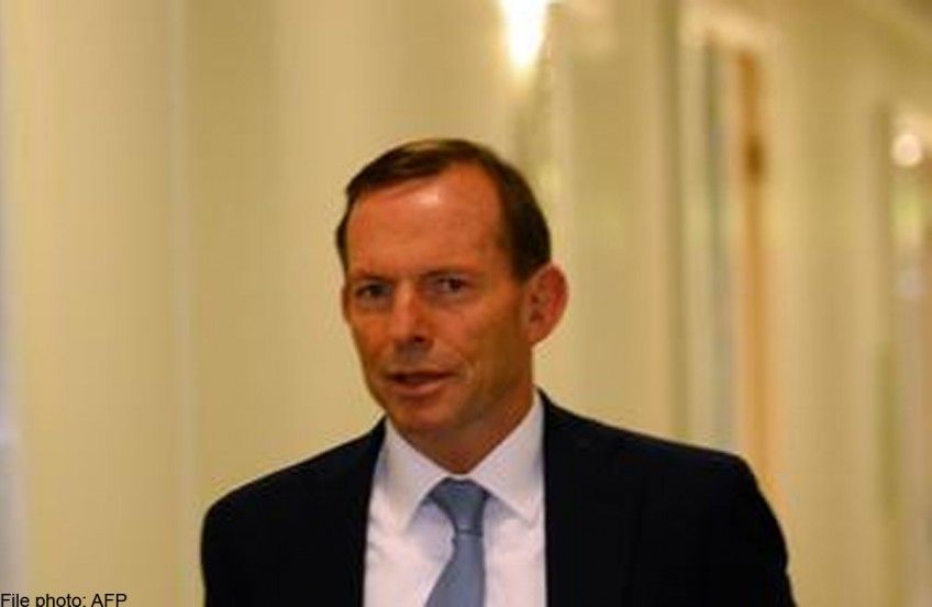 Australia PM drops parental leave plan, says no intention to quit