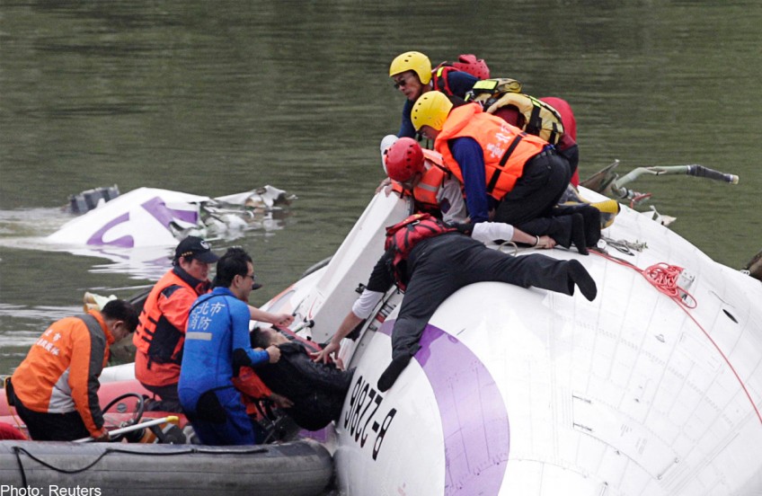 At least 25 dead as Taiwan plane plunges into river 