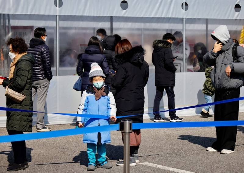 South Korea daily Covid-19 cases top 100,000 for first time, curfew eased