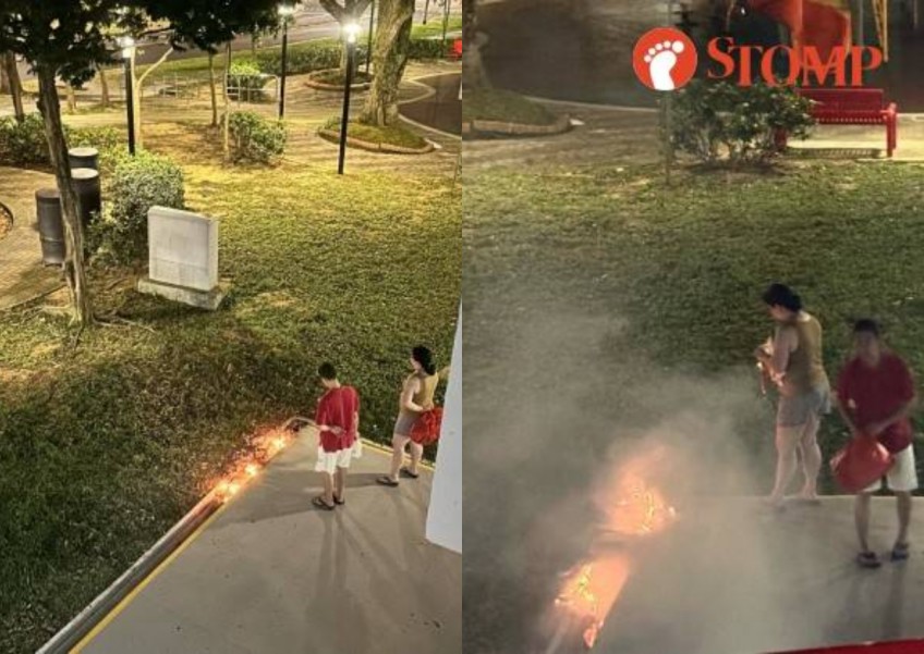 Geylang resident upset by couple burning offerings at drain instead of bins nearby, says smoke woke him up