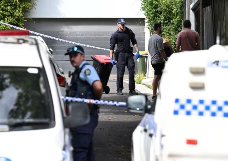 Australian police officer charged with murdering 2 missing Sydney men