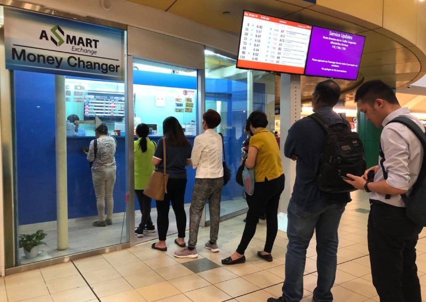 'I ran out of stock by afternoon': Money changers kept busy as Malaysian ringgit hits new low against Singapore dollar 