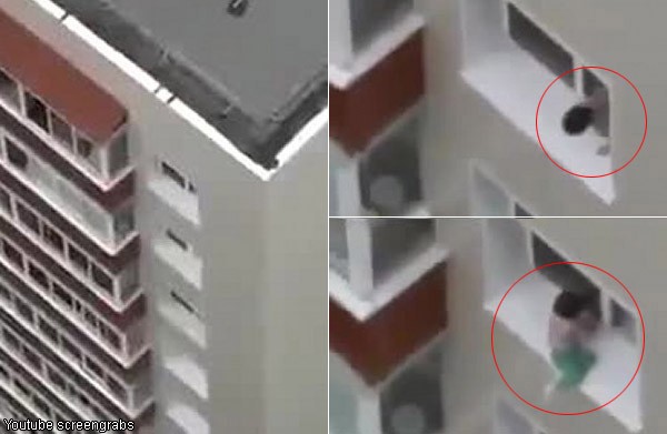 Heart-stopping video shows child playing dangerously on ledge of high-rise block