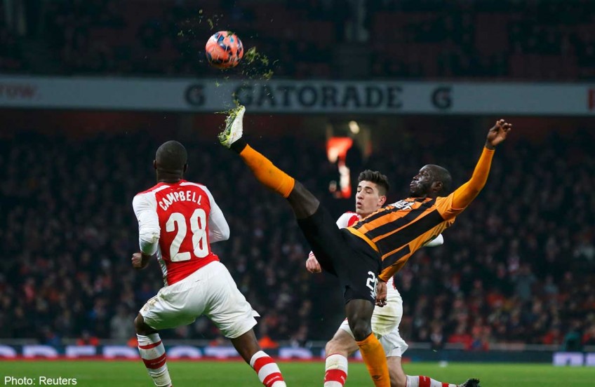 Football: Arsenal bounce back to tame toothless Tigers