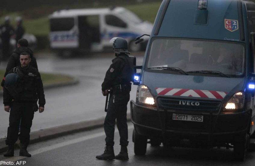 French police trying to 'establish contact' with massacre suspects
