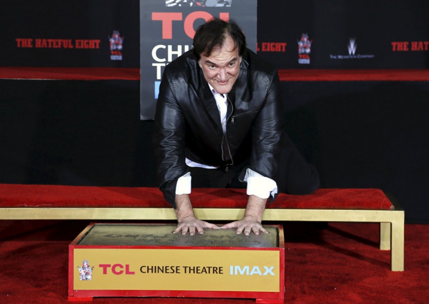 Tarantino shuns rain to leave imprint on Hollywood