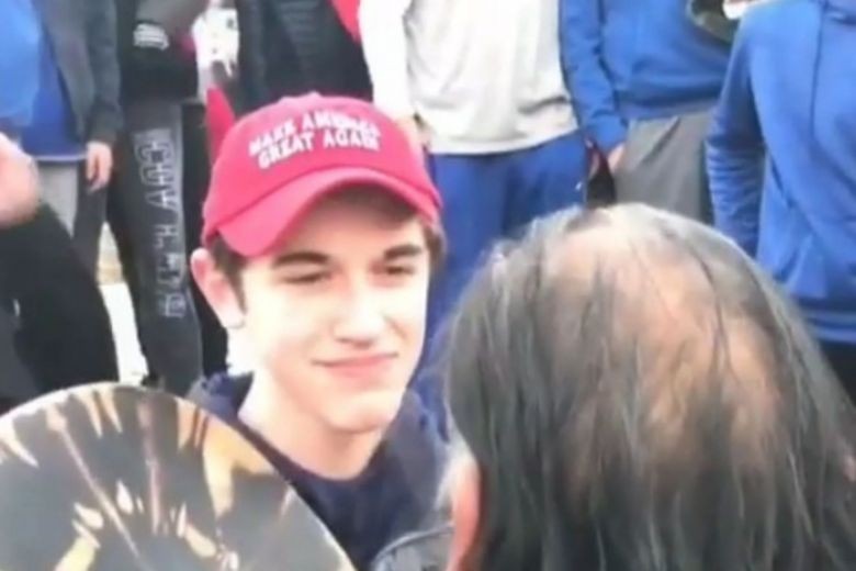 Boys in Trump hats mock Native American man; school condemns students