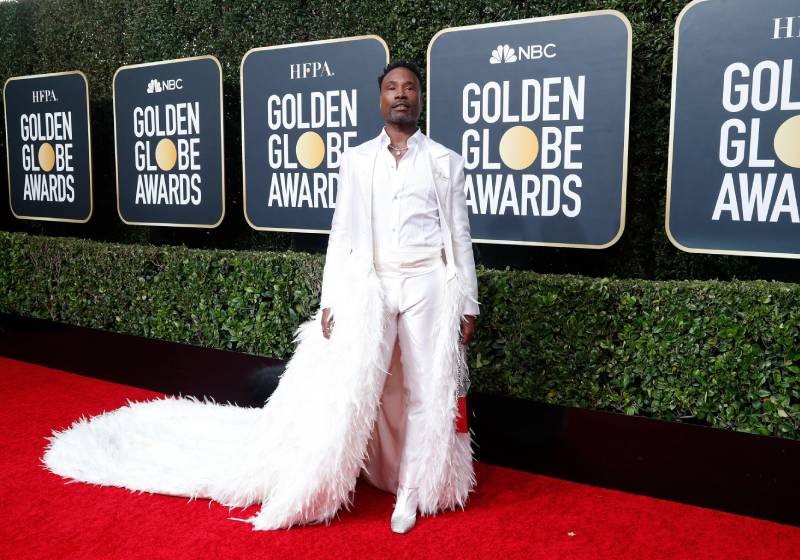 Billy Porter wows in white feather train