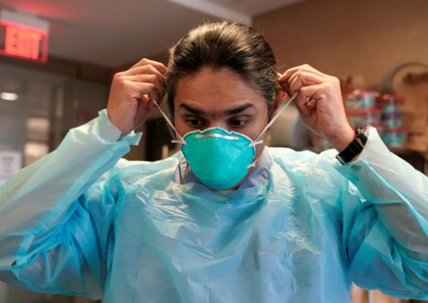 Mask mandates return at some US hospitals as Covid, flu jump