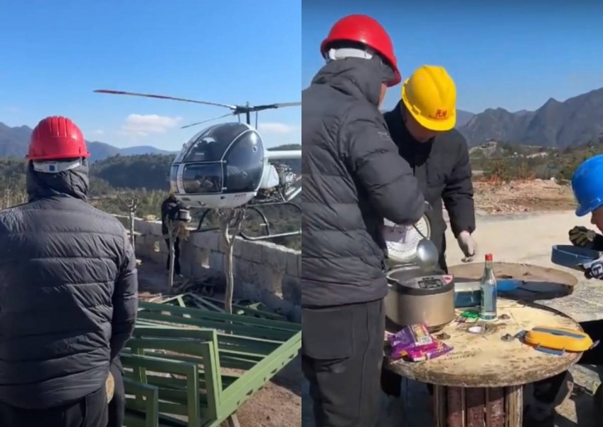 Going the extra mile: Boss in China flies helicopter to deliver lunch daily to workers on mountaintop