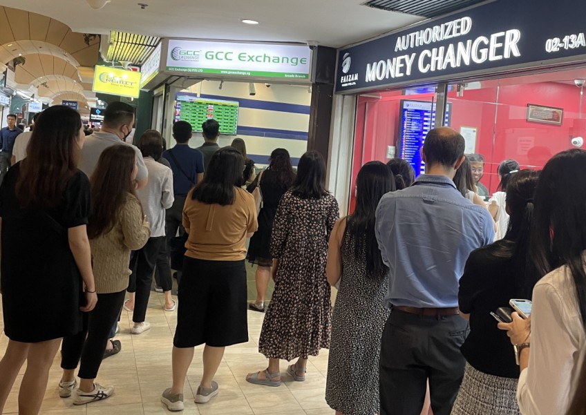 Singaporeans take to money changers with ringgit at record low: 'You never know if it will be like this again'
