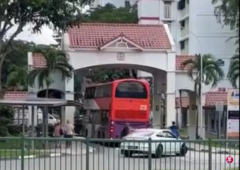 'Maybe it's chartered': Netizens joke after bus makes wrong turn and gets stuck in Bedok HDB carpark