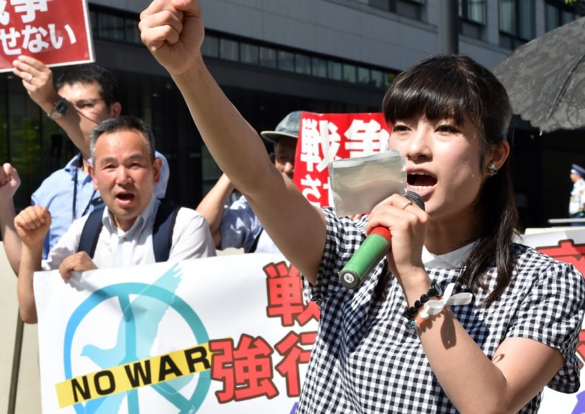 Japan security debate masks clash of views on pacifist constitution