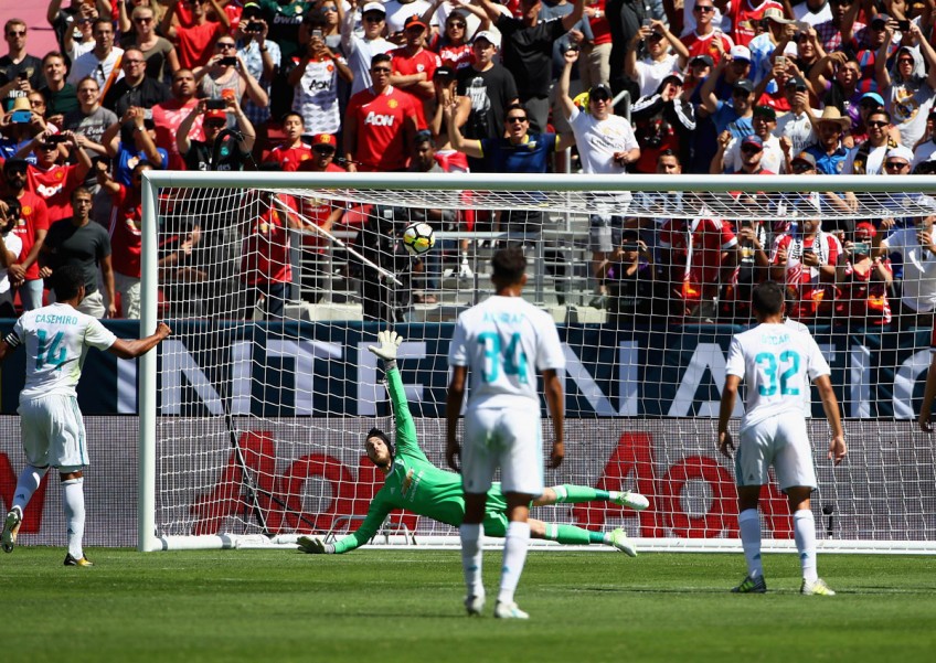 Football: Manchester United edges Real Madrid on penalty kicks