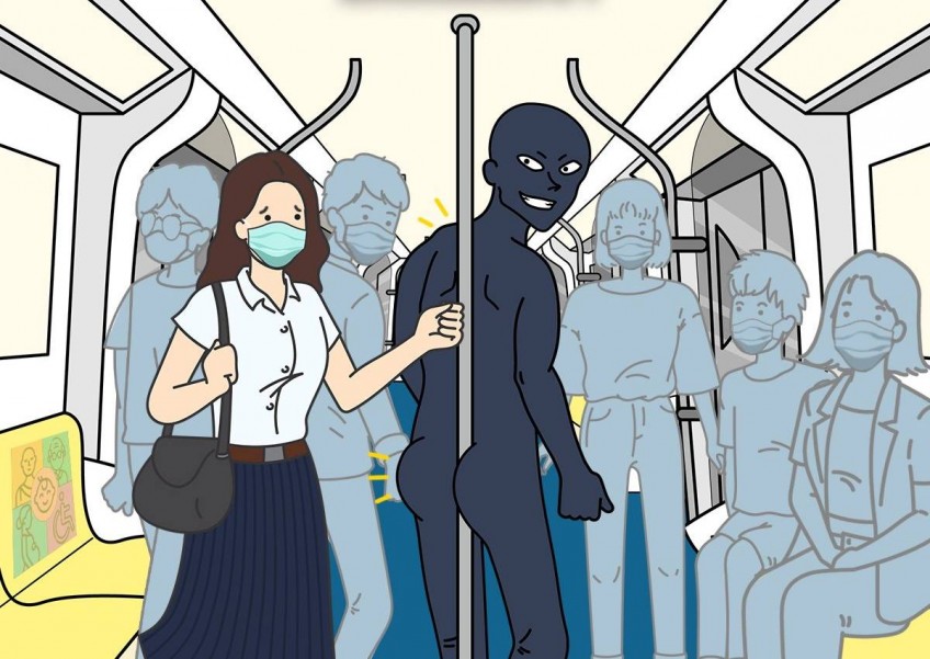 Cheeky 'butt-clenching' poster to deter pole-hoggers on Bangkok BTS train goes viral