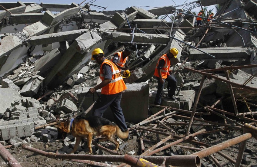 At least 11 killed, others trapped in India building collapse