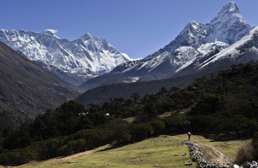 Come visit, Nepal's recovering, guides say