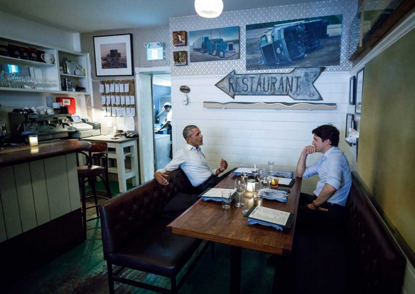 WATCH: Trudeau and Obama hug it out after candlelight dinner in Montreal