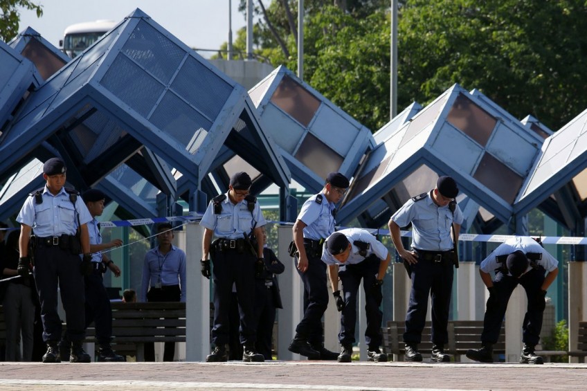Woman arrested after 4 injured in Hong Kong shooting
