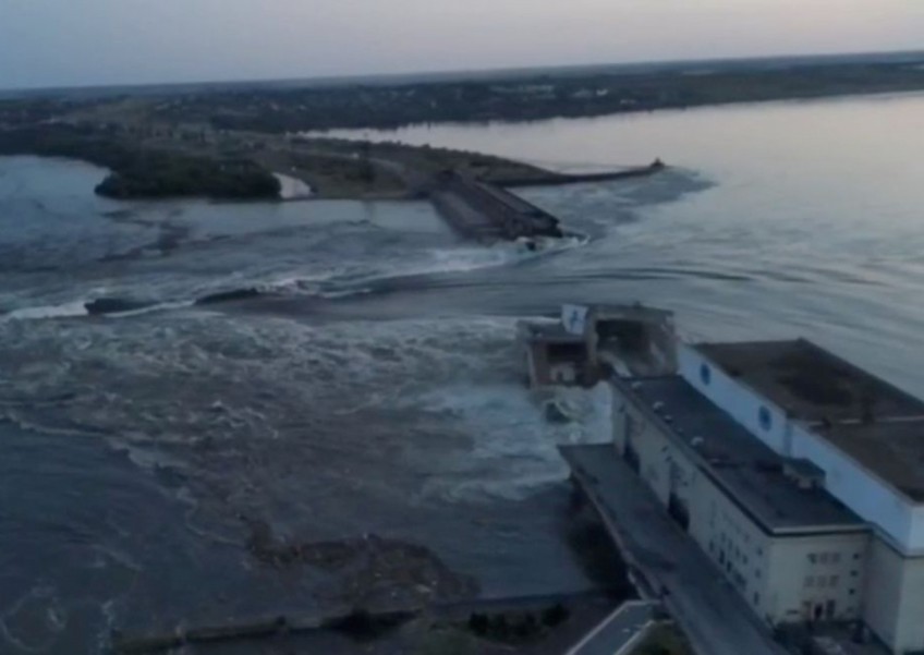 Ukraine dam supplying water to nuclear plant and Crimea is breached, unleashing floods
