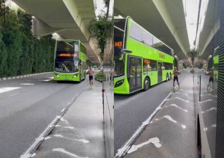 Shirtless man blocks bus while jogging dangerously along Pasir Panjang Road