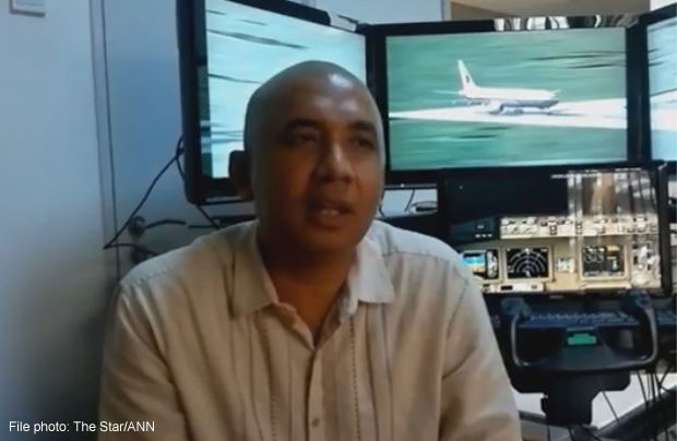 Malaysian police search home of missing plane's pilot: Official