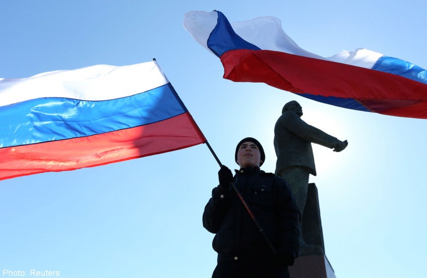 Putin takes first steps for Russia to absorb Crimea