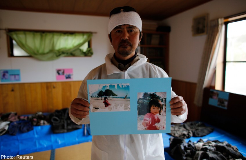 Four years on, Japan's tsunami victims frozen in their tragedy