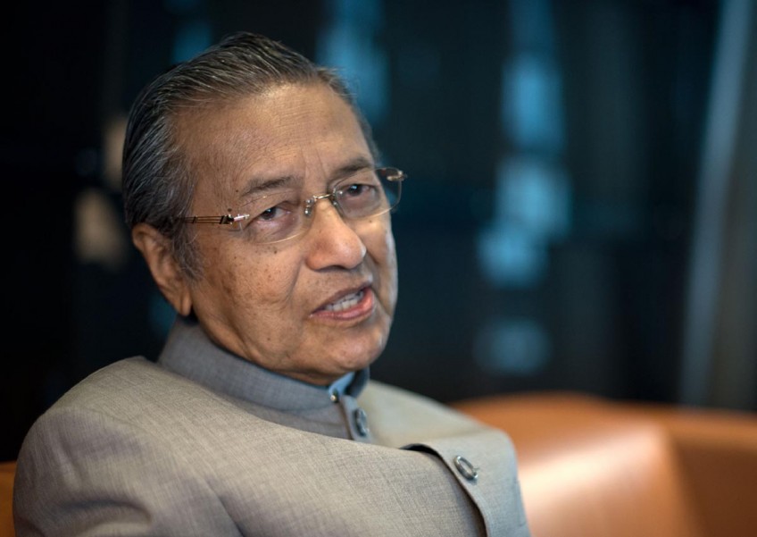 Mahathir seeks court order to freeze Najib's assets